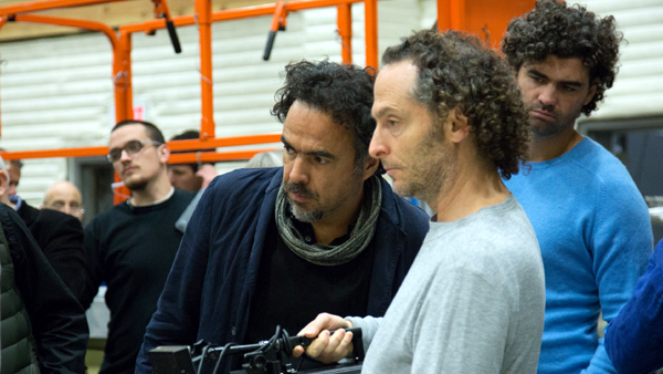 writer/director Alejandro González Iñárritu (grey scarf), director of photography Emmanuel Lubezki (holding the camera), and co-writer Armando Bo (light blue shirt) shooting Birdman