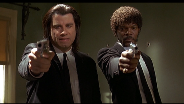 John Travolta as Vincent Vega and Samuel L. Jackson as Jules Winnfield in Quentin Tarantino's Pulp Fiction John Travolta as Vincent Vega and Samuel L. Jackson as Jules Winnfield in Quentin Tarantino's Pulp Fiction