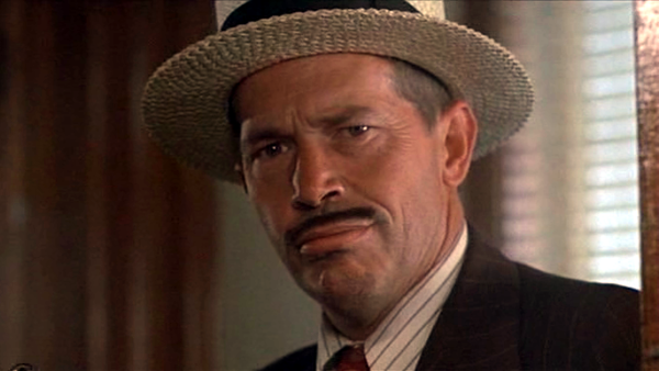 Warren Oates as John Dillinger in Dillinger