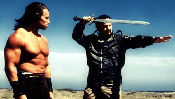 John Milius on the set of Conan the Barbarian with Arnold Schwarzenegger