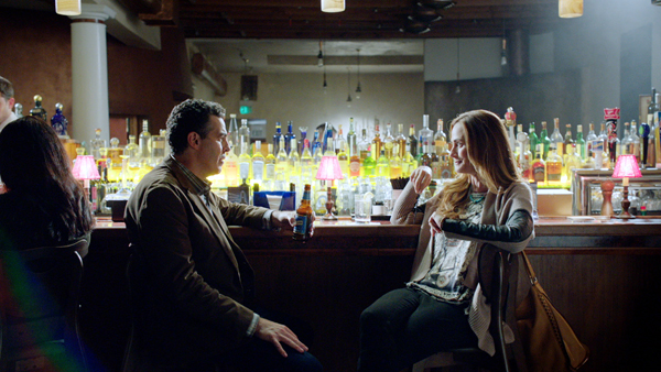 Adam Carolla as Bruce Madsen and Diane Far as Sarah in Road Hard
