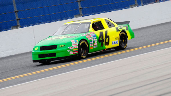 Tom Cruise drives the car used in the film "Days of Thunder" on track prior to the NASCAR Sprint Cup Series Daytona 500