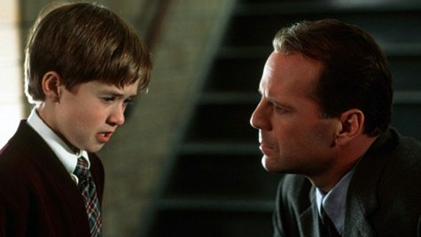 Haley Joel Osment as Cole Sear and Bruce Willis as Dr. Malcolm Crowe in The Sixth Sense
