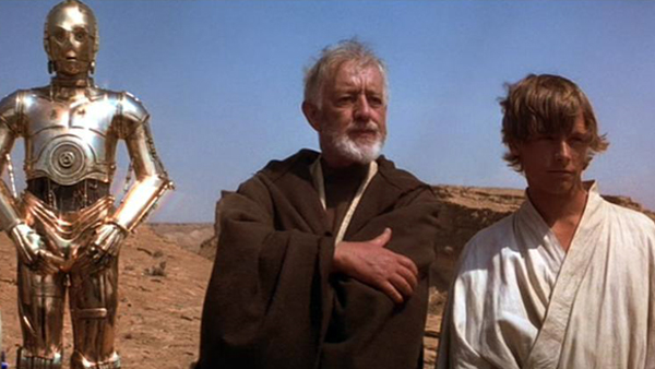 Anthony Daniels as C-3P0, Alec Guiness as Ben Obi-Wan Kenobi and Mark Hamill as Luke Skywalker in Star Wars: Episode IV - A New Hope